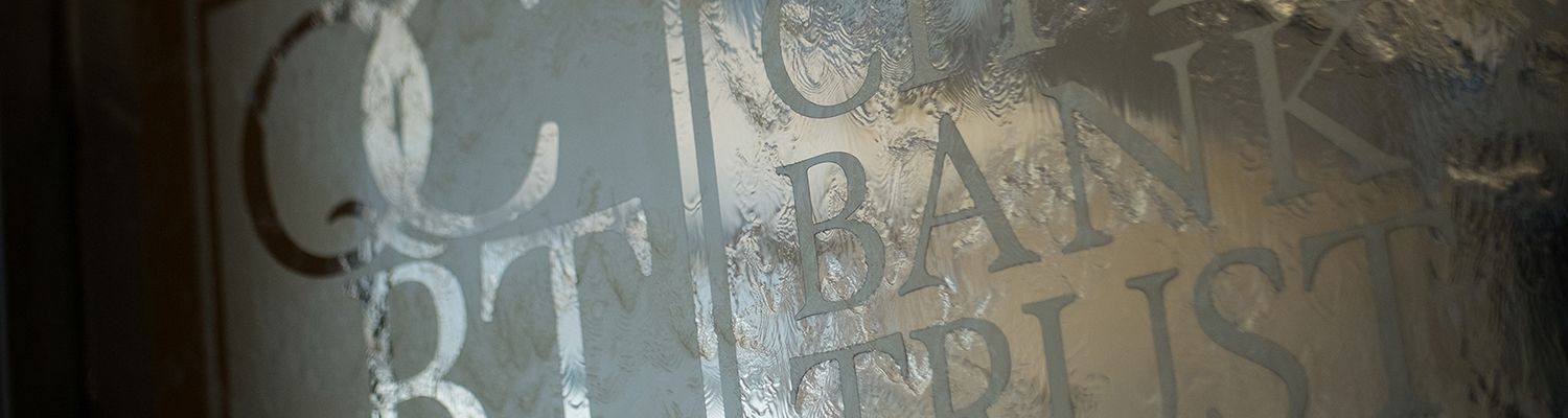Glass quad city bank and trust logo