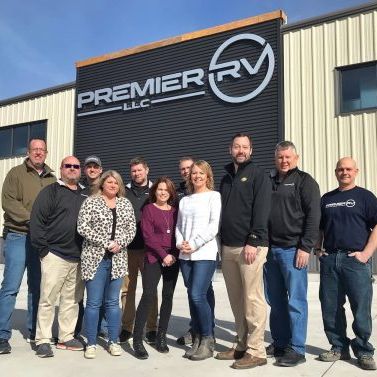 A group standing outside of Premier RV building